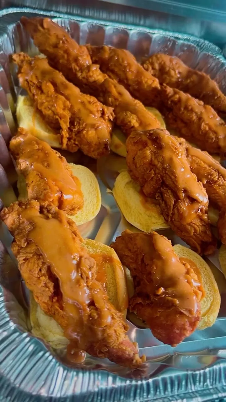 Catering trays of golden fried chicken tenders