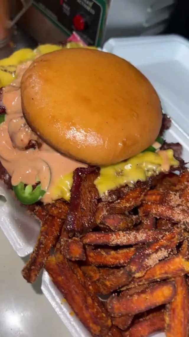 Half pound smash burger served with sweet potato fries